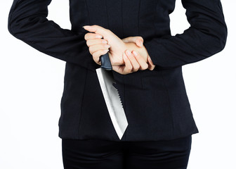 Back of business woman with aknife