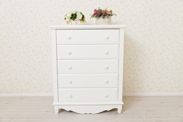 A white dressing table, glass mirror