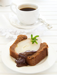Chocolate cake with pears and chocolate sauce.