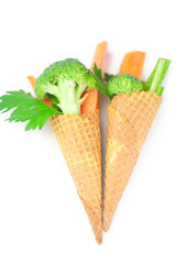 carrot, celery, broccoli in a waffle cone isolated on white