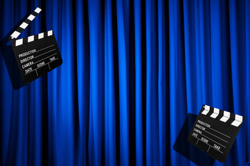 Movie clapper board against curtain