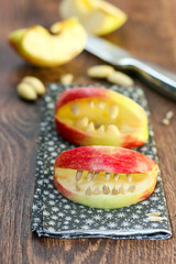 Quarters of apple with seeds and almond