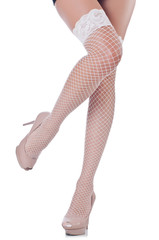 Woman legs with stockings on white