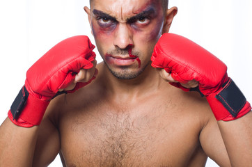 Badly beaten boxer isolated on white