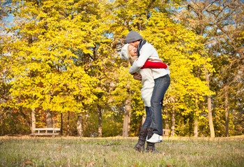 Young romantic couple have a fun in park.