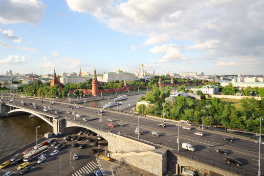 Moskva river, cars at Big Stone Bridge, Red towers of Kremlin
