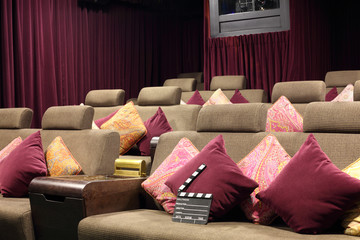 Movie сlapper board on lounge with cushions