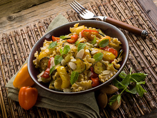 pasta with capsicum zucchinis and sliced almond