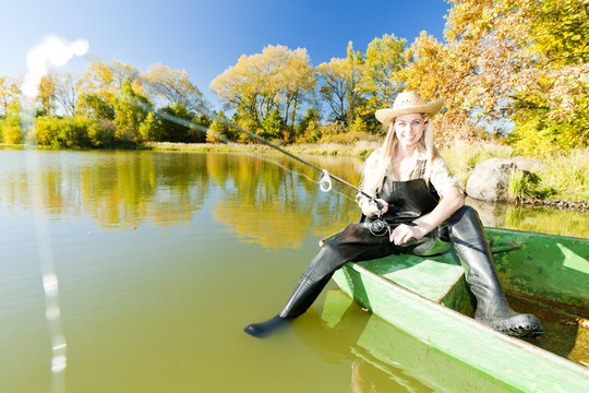 Fishing Woman Sitting On Boat