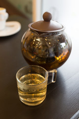 brown hot tea pot on table