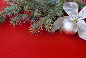 Silver New Year's decoration on red background