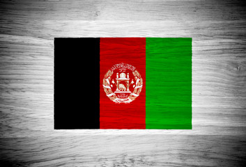 Afghanistan flag on wood texture