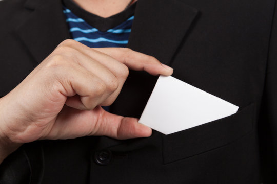 Businessman taking a blank card from the pocket