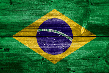 Flag of Brazil painted on grungy wood plank background