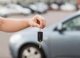 man with car key outside