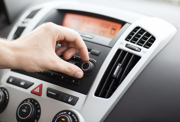 man using car audio stereo system