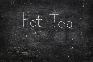 Chalk on black board: Hot Tea