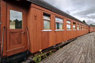 Fototapeta na wymiar Old railway station and wooden train car