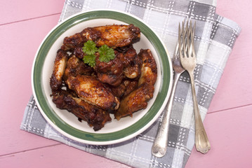 grilled chicken wings in a bowl