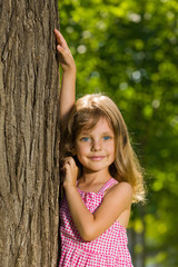 Young girl near a tree