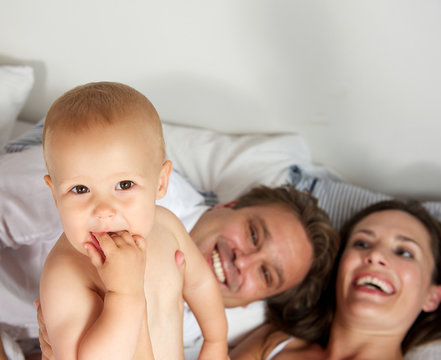 Portrait of a happy young family smiling together