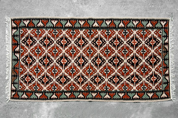 Old traditional romanian wool carpet with ancient motifs