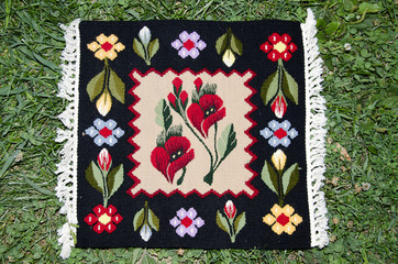 Old traditional romanian wool carpet with ancient motifs