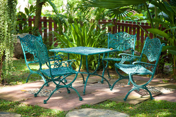 Chairs and tables, located in the garden.