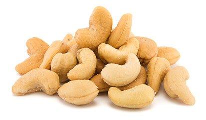 Heap of cashew nuts isolated on white background