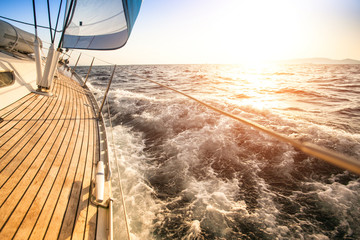 Sailing to the Sunrise. Luxury yacht. - obrazy, fototapety, plakaty