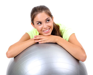 Young beautiful fitness girl with grey ball isolated on white