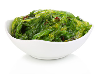 Sea kale in bowl close-up isolated on white