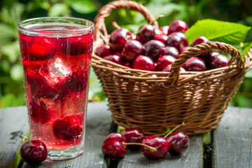 Freshly harvested sweet cherries and juice