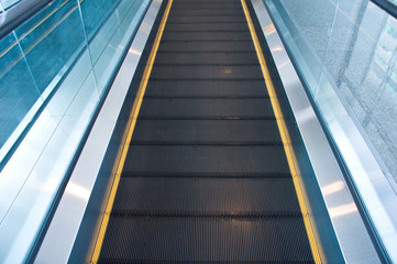 Moving escalator in an airport