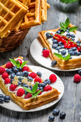 Waffles with fresh berry fruit and mint leaf