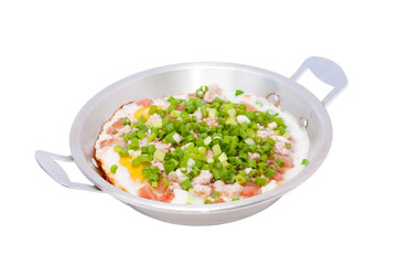 fried eggs with meat in pan