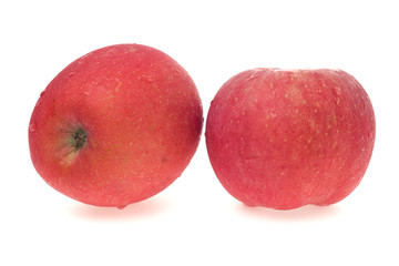 Apples with water droplets on white background