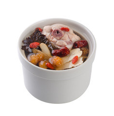 Chicken and herb soup in pot, Chinese food style.