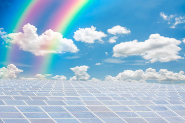 sun panels and rainbow on blue sky background
