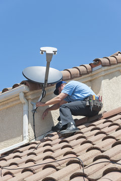 Satellite Installer on Roof 3.