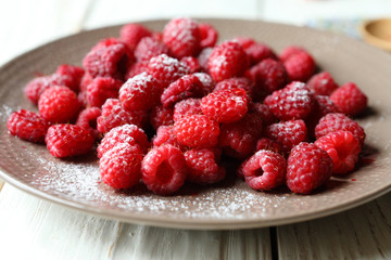 ripe raspberries on a plate