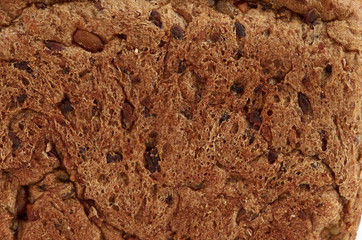 background texture of a porous brown bread