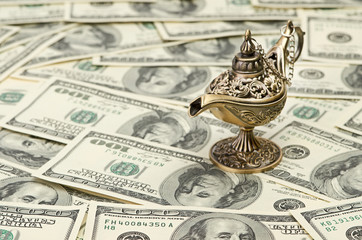 aladdin lamp on dollar background