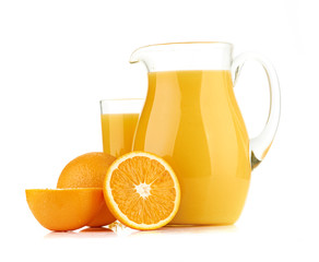 Jug, glass of orange juice and orange fruits