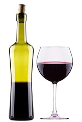 Elegant red wine glass and bottle