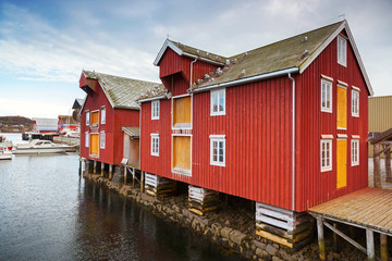 Red and yellow wooden coastal houses in Norway