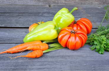 Fresh vegetables on an old wooden table