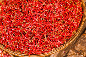Naklejka premium Preservation procedure of red Chili peppers on basket