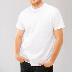 smiling man in blank white t-shirt
