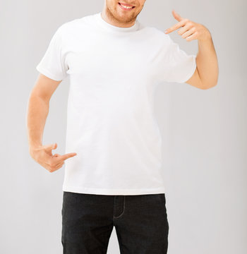 man pointing at blank white t-shir